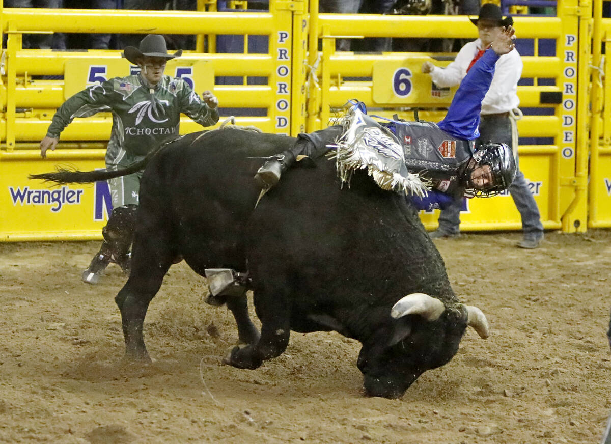 Stetson Dell Wright of Milford, Utah competes in the bull riding event during the seventh go-ro ...