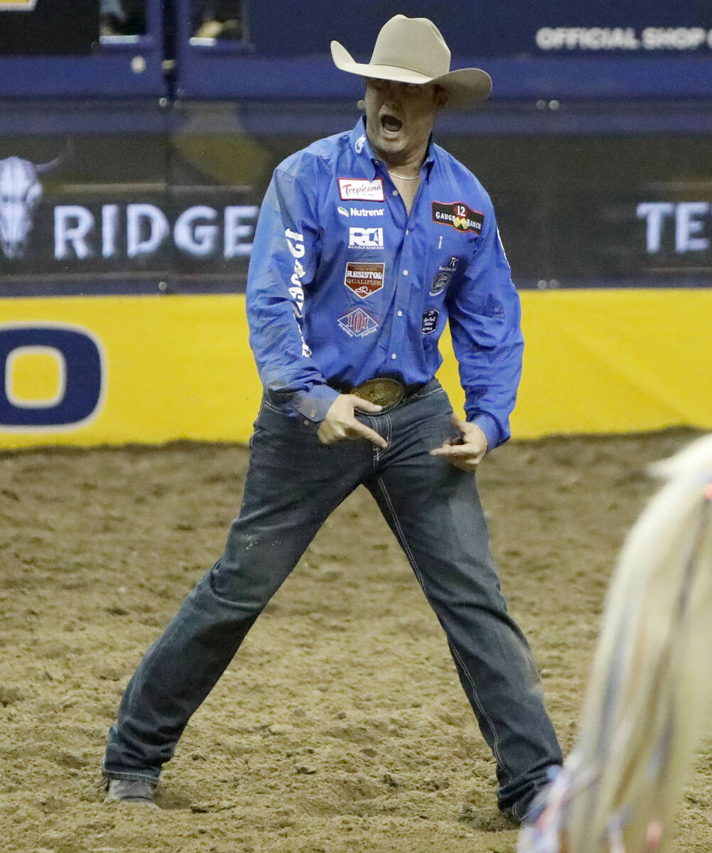 Tyler Waguespack of Gonzales, La. reacts after he competed in the steer wrestling event during ...