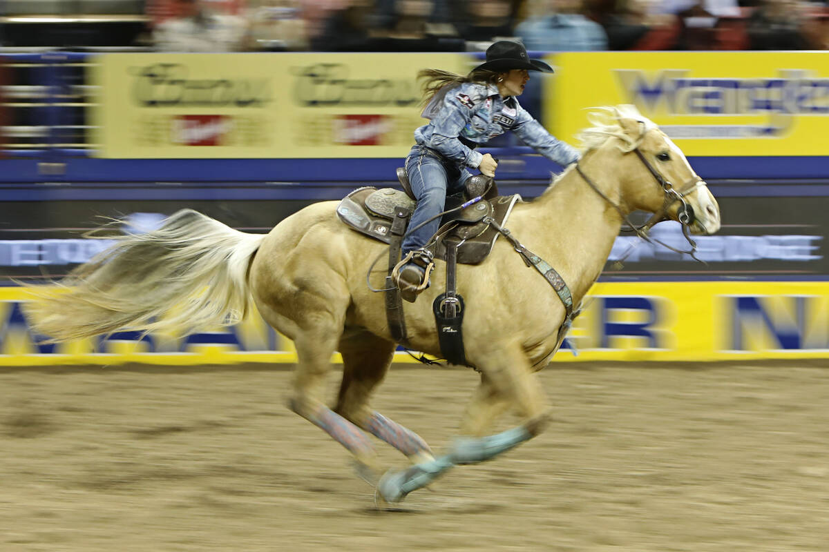 Hailey Kinsel of Cotulla, Texas competes in the barrel racing event during the seventh go-round ...