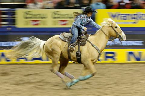 Hailey Kinsel of Cotulla, Texas competes in the barrel racing event during the seventh go-round ...