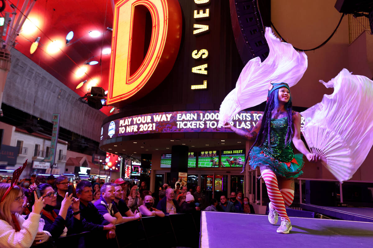Tida Suribongot performs on the 3rd Street Stage during a Christmas Tree lighting ceremony at t ...