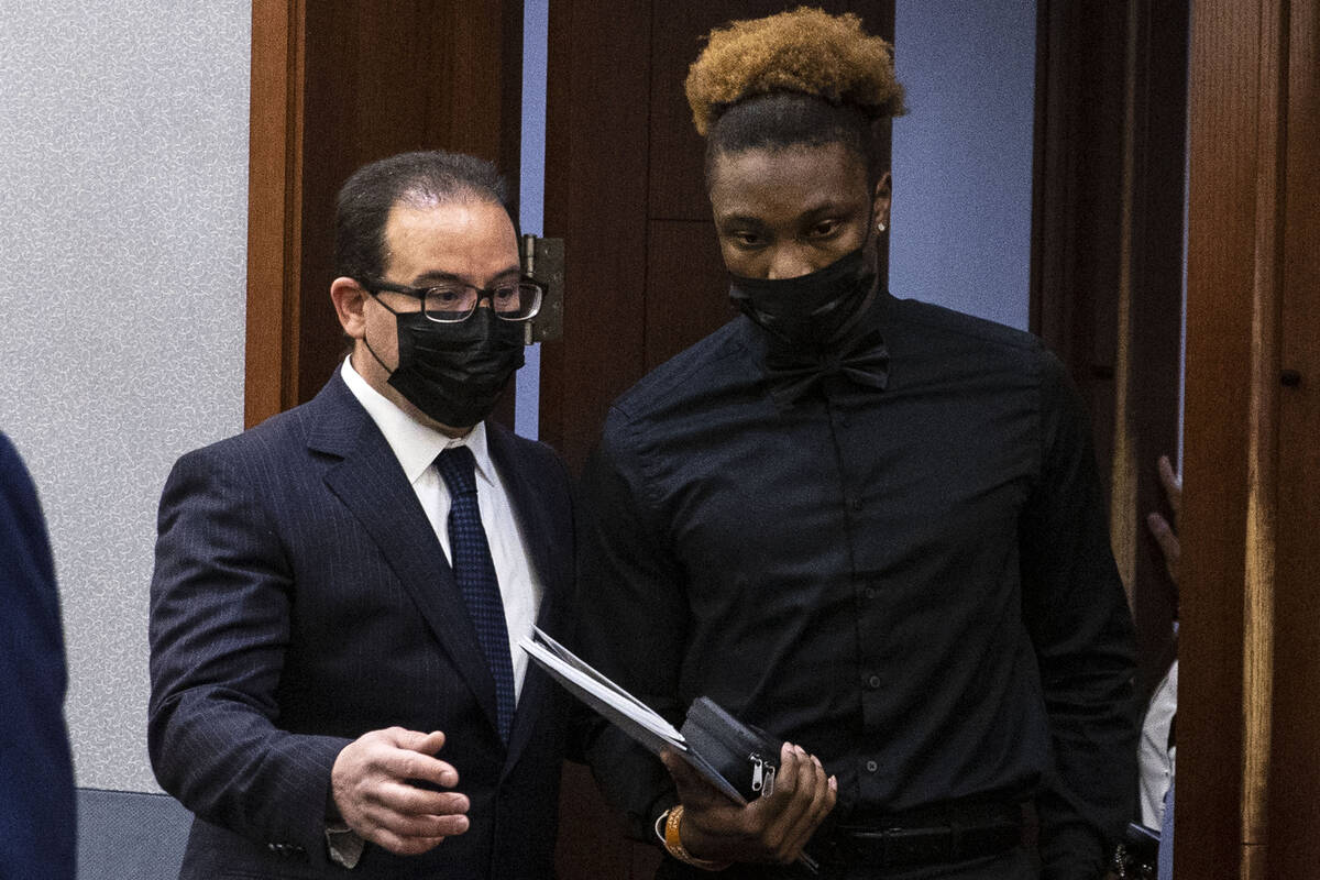 Henry Ruggs, right, former Raiders wide receiver, accused of DUI resulting in death, enters the ...