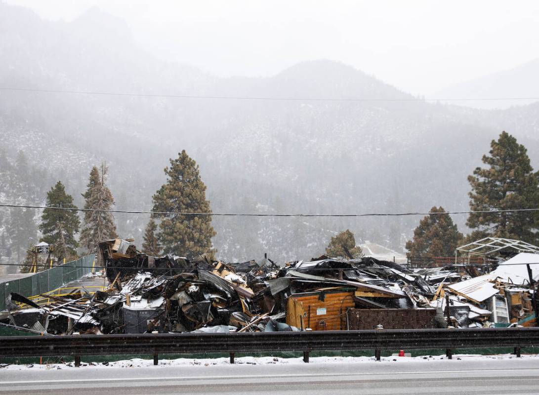 Debris of the former Mount Charleston Lodge is seen as light snow fall on the Mt. Charleston ar ...