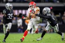 Kansas City Chiefs tight end Travis Kelce (87) breaks off a big run past Raiders cornerback Nat ...