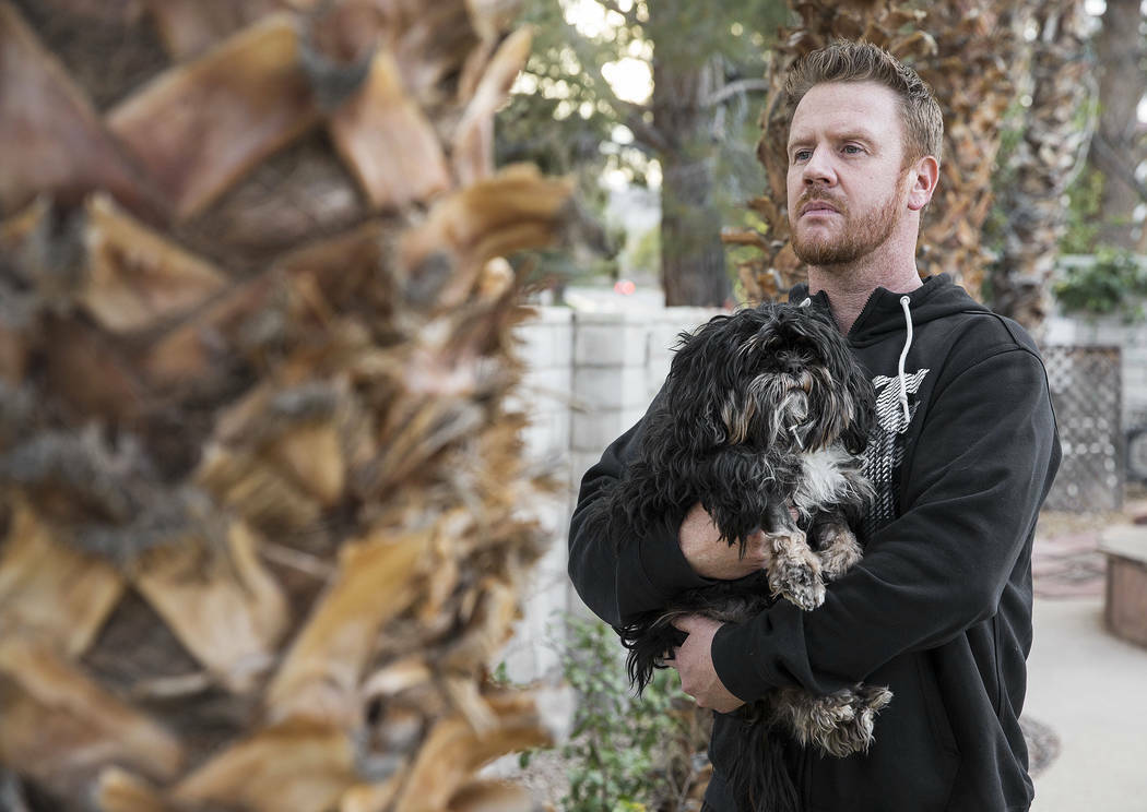 Sean Cornwall holds Luke, a 3-year-old Shih Tzu, at his home in Las Vegas on Friday, April 5, 2 ...
