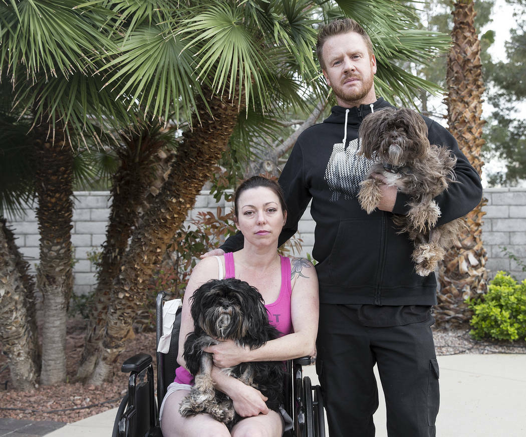 Sean and Teri Cornwall hold Shih Tzu's Luke, left, and Chewie at their home on Friday, April 5, ...