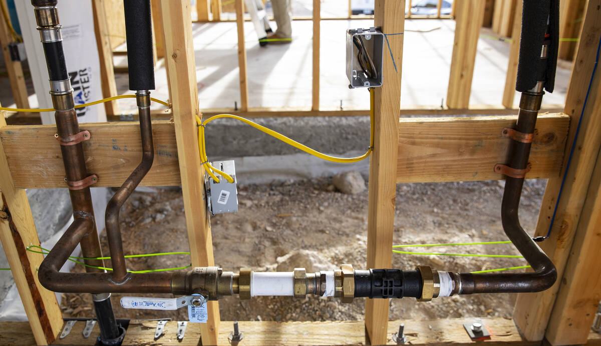 Plumbing pipes are seen at Lennar at Heritage at Stonebridg, the newest 55+ active adult housin ...