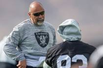 Raiders interim head coach Rich Bisaccia speaks to Raiders tight end Darren Waller (83) during ...