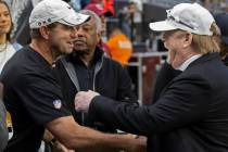 Clemson head football coach Dabo Swinney, left, greets Raiders owner Mark Davis before the star ...