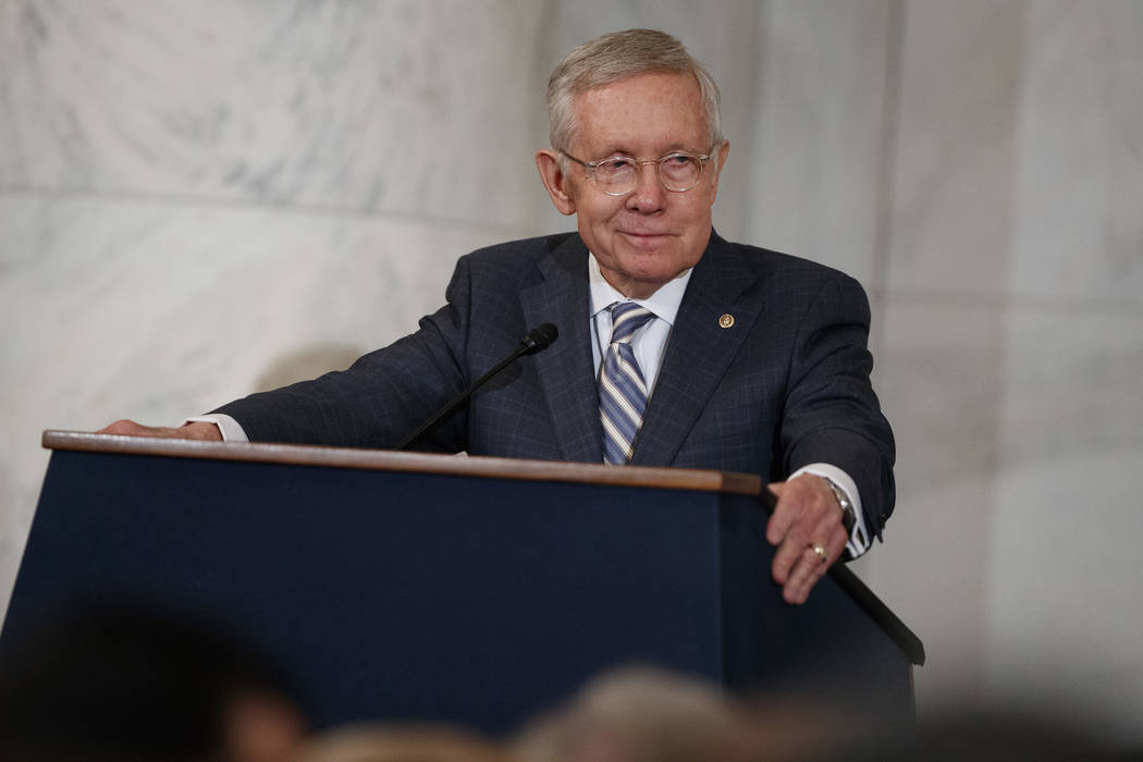 Sen. Harry Reid, D-Nev., speaks during during a ceremony to unveil his portrait on Capitol Hill ...