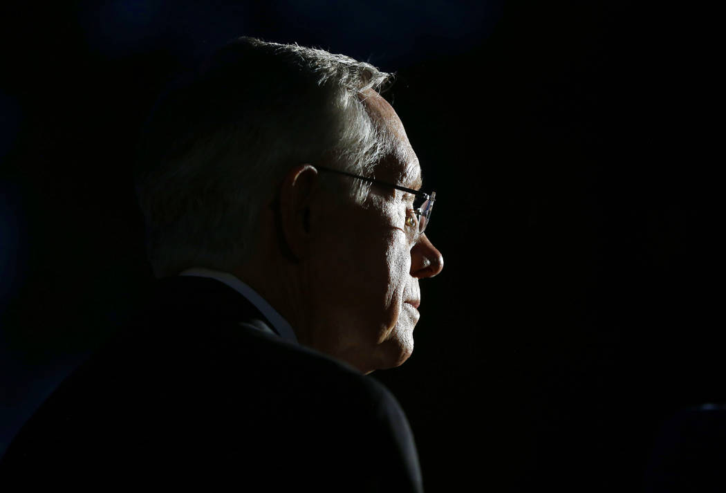Senate Majority Leader Harry Reid, D-Nev., waits outside the West Wing of the White House after ...