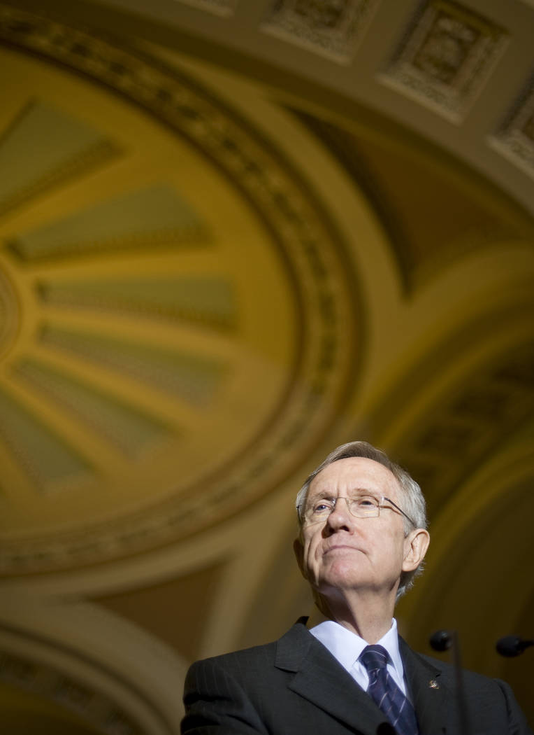 Senate Majority Leader Harry Reid speaks to reporters following the Senate Democrats' policy lu ...