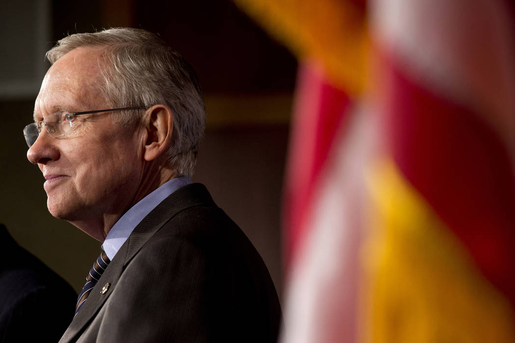 Senate Majority Leader Harry Reid of Nevada listens during a news conference on Capitol Hill in ...
