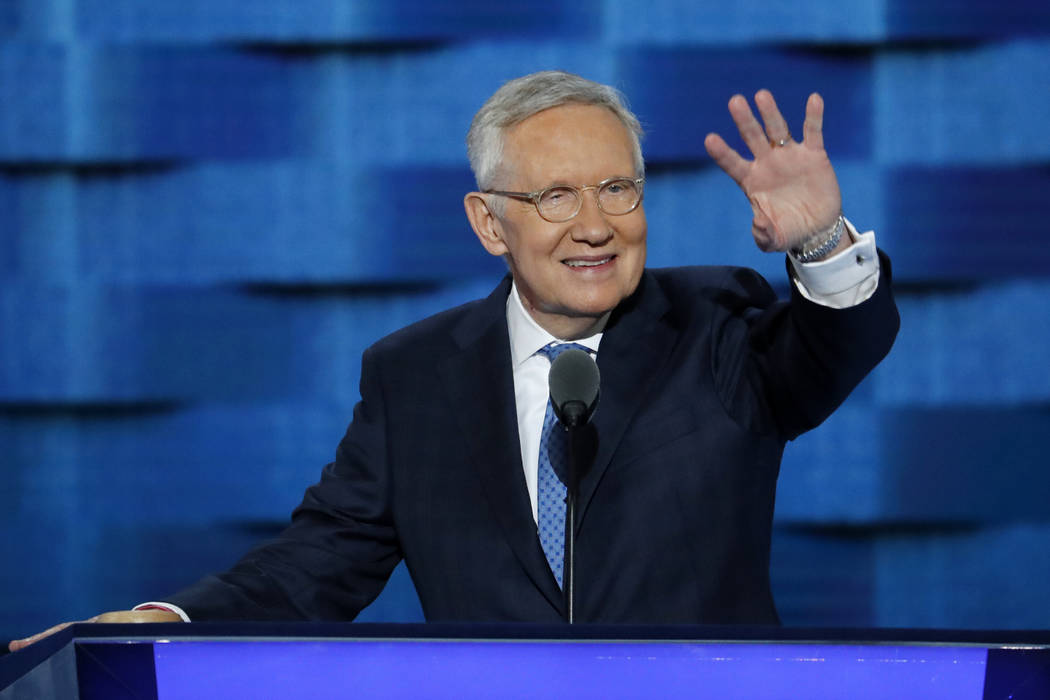 U.S. Sen. Harry Reid, D-Nev., waves from the podium during the third day of the Democratic Nati ...