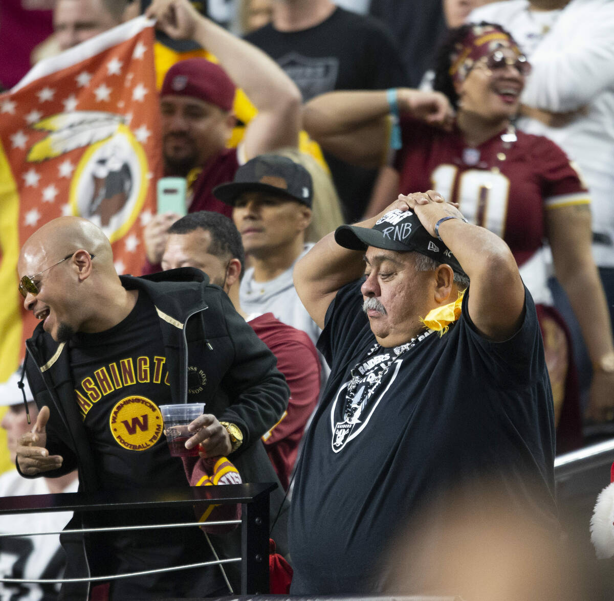 A Raiders fan reacts after the Washington Football Team scored a touchdown during the fourth qu ...
