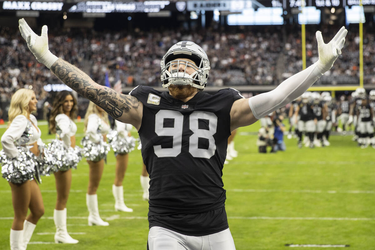 Raiders defensive end Maxx Crosby (98) is announced before the start of an NFL football game ag ...