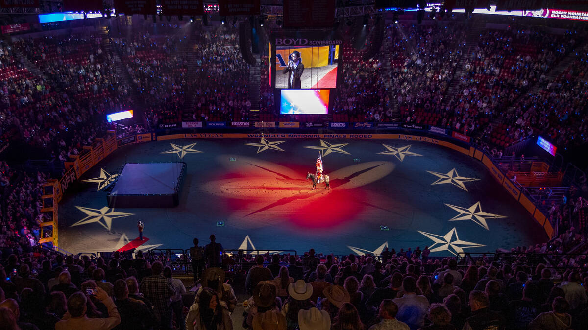 Drake Milligan sings the National Anthem at the start of the opening night of Wrangler National ...