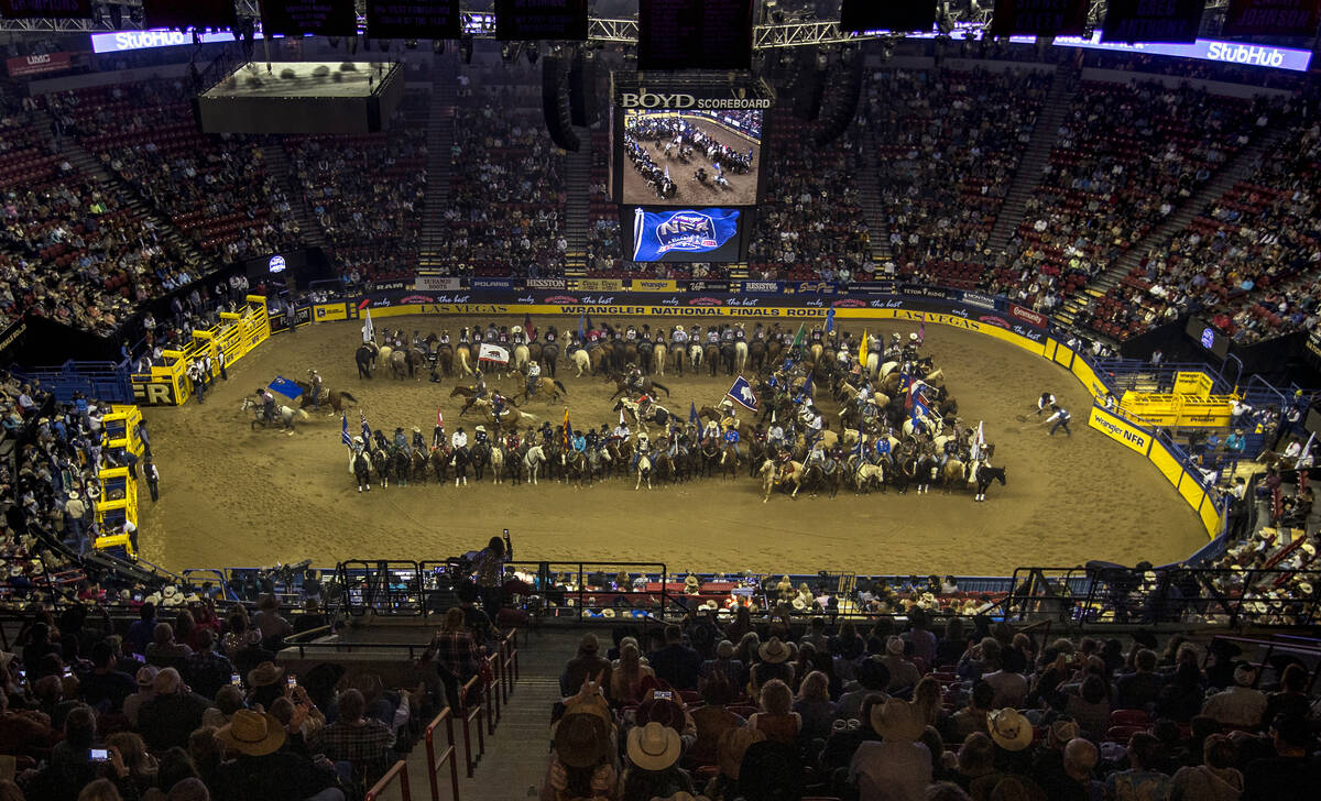 Competitors gather in the arena as the fans applaud at the start of the opening night of Wrangl ...