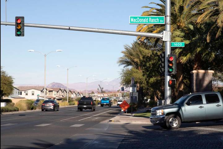 A motorist exits MacDonald Highlands neighborhood on Friday, Dec. 10, 2021, in Las Vegas. (Elle ...