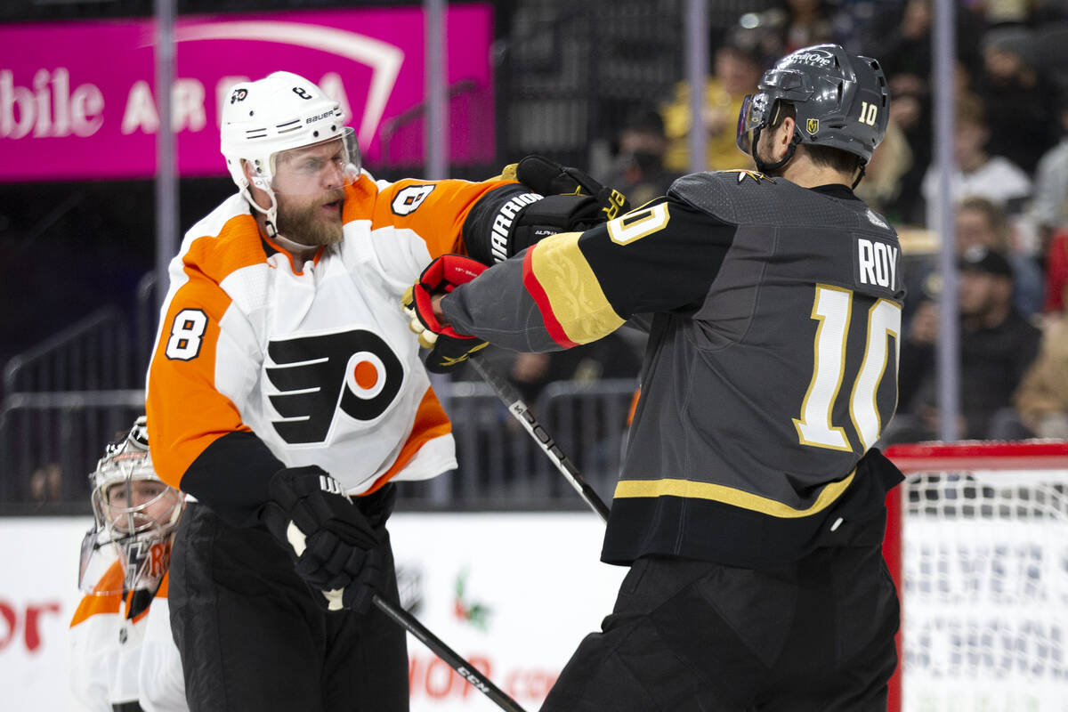 Flyers defenseman Kevin Connauton (8) takes a swing at Golden Knights center Nicolas Roy (10) d ...