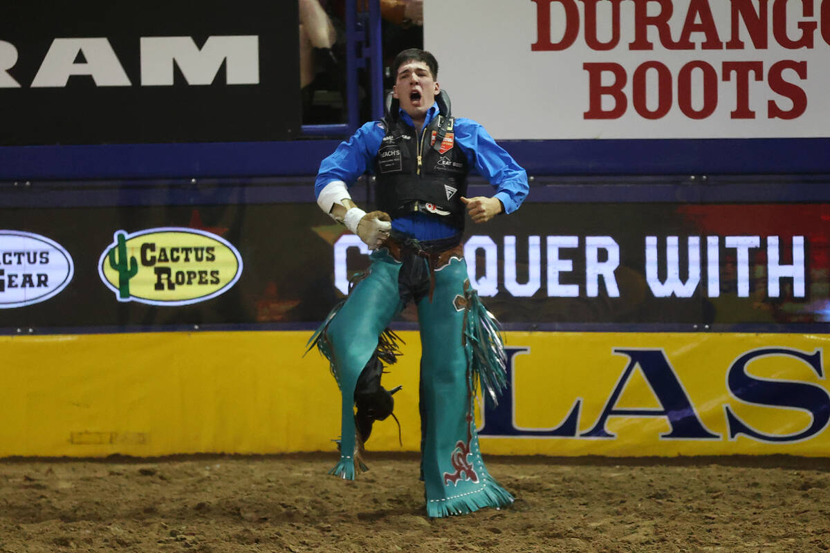 Jess Pope of Waverly, Kan., reacts after his run in the bareback riding event during the tenth ...