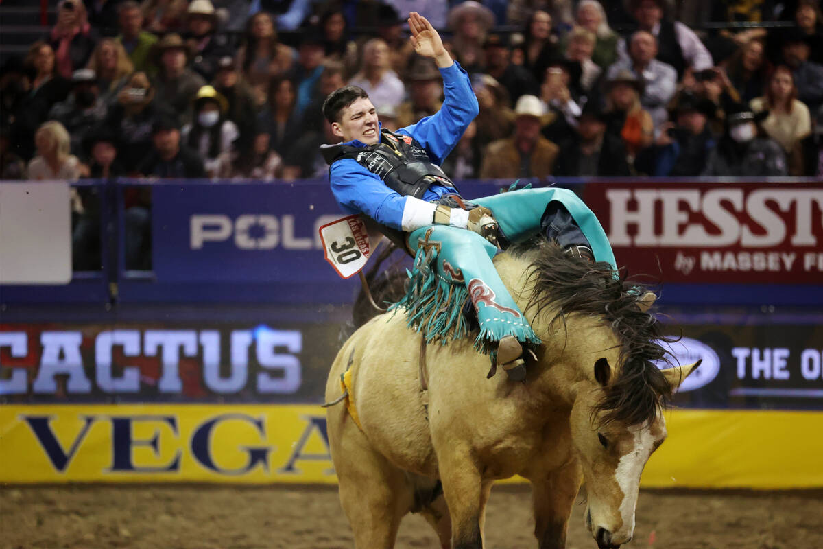 Jess Pope of Waverly, Kan., competes in the bareback riding event during the tenth go-round of ...