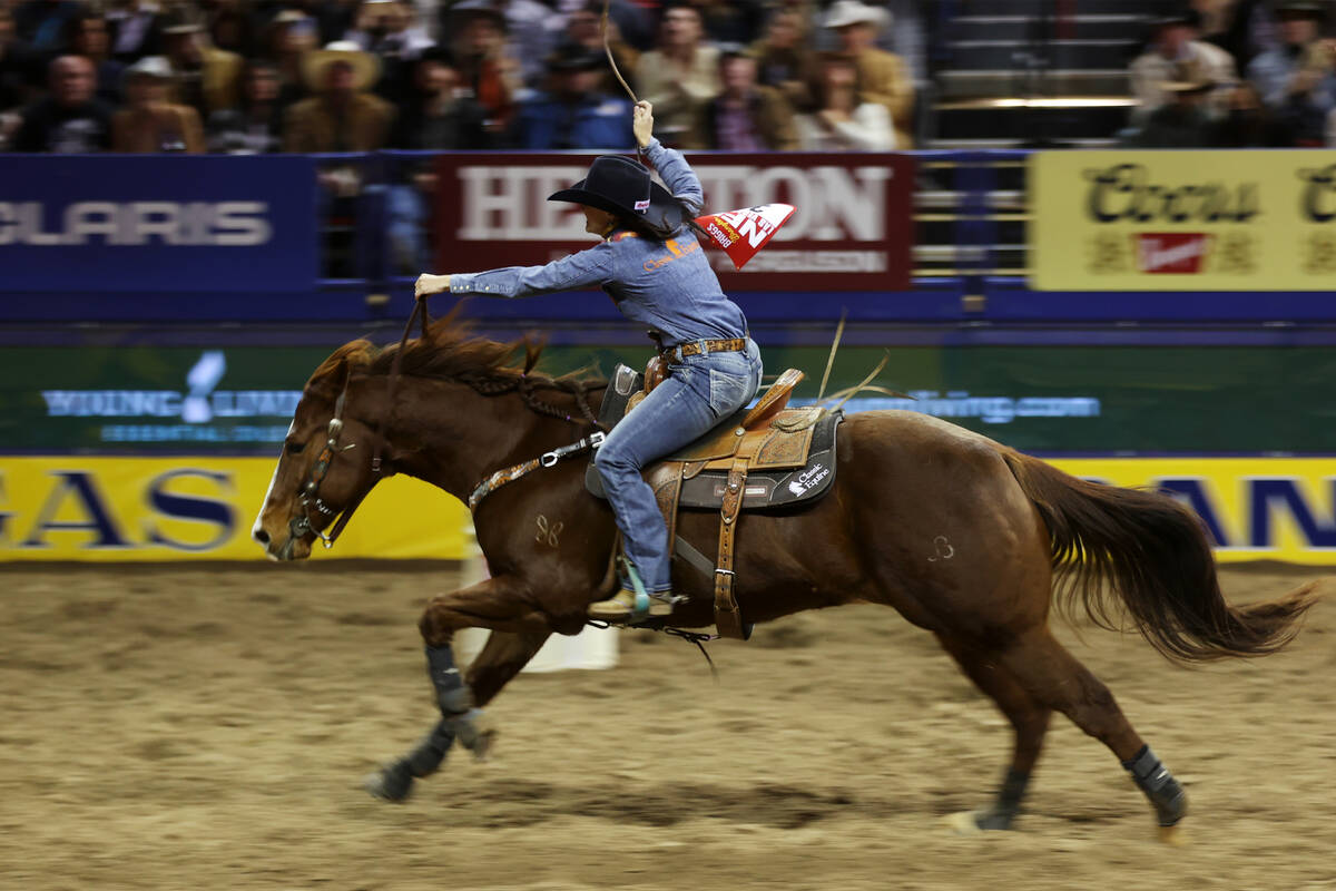Jordon Briggs of Tolar, Texas, competes in the barrel racing event during the tenth go-round of ...