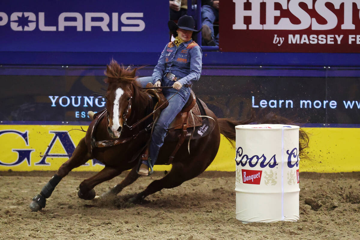 Jordon Briggs of Tolar, Texas, competes in the barrel racing event during the tenth go-round of ...