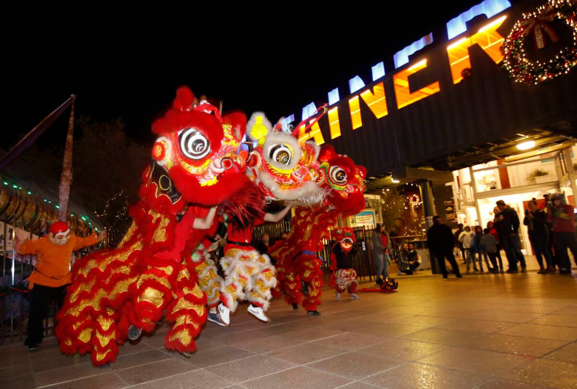 Members of Lohan School of Shaolin perform lion dance, Saturday, Dec. 11, 2021, during Wake Up ...