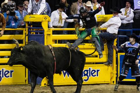 Josh Frost of Randlett, Utah, is thrown from Barracuda in bull riding during the fourth round o ...
