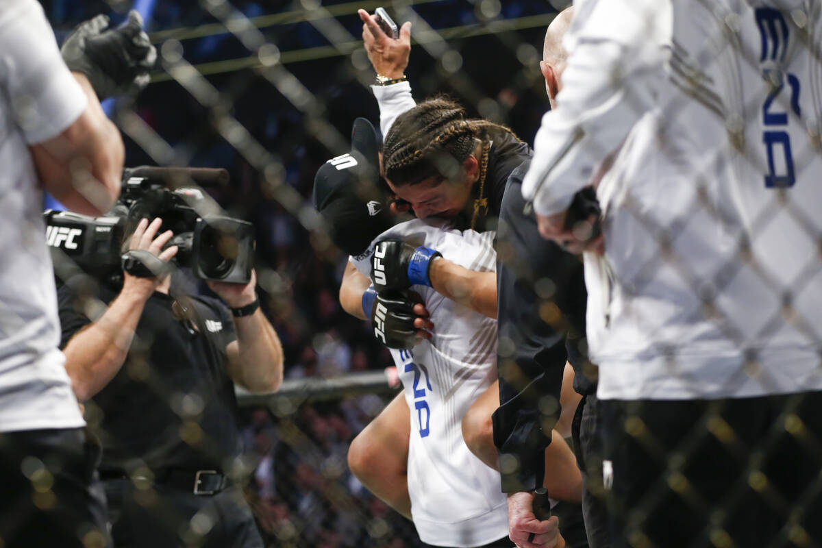 Julianna Pena celebrayes after defeating Amanda Nunes by submission in a women's bantamweight m ...