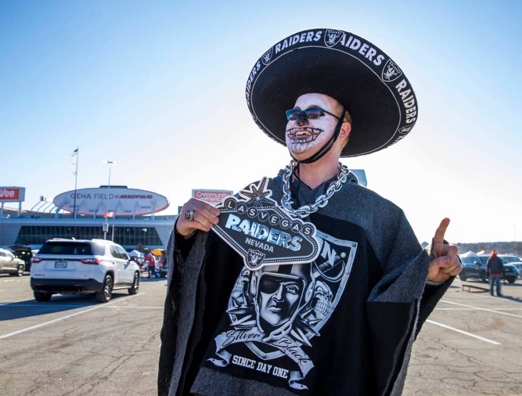 Raiders fan Scottie Lutz of Lee Summit, MO., is decked out and ready in the red lot tailgate be ...