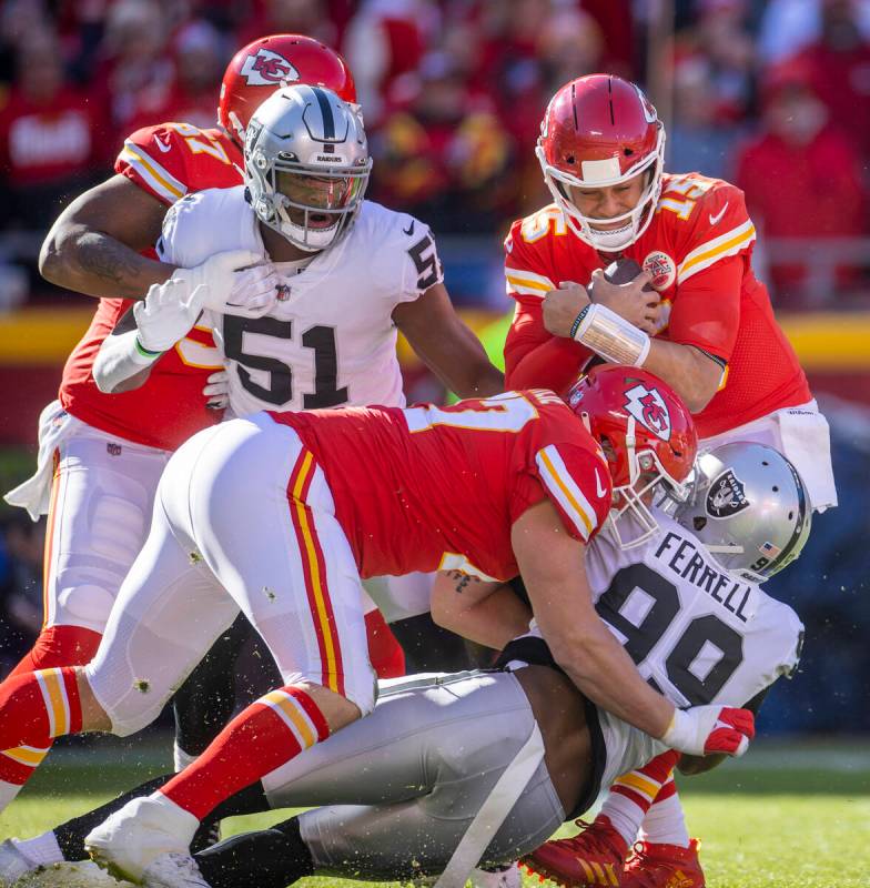 Raiders defensive end Clelin Ferrell (99) sacks Kansas City Chiefs quarterback Patrick Mahomes ...