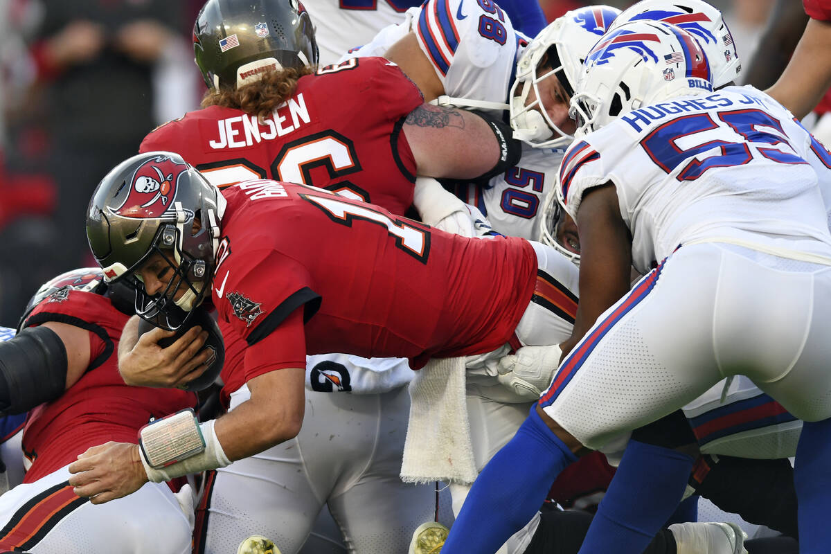 Tampa Bay Buccaneers quarterback Tom Brady (12) dives for a first down against the Buffalo Bill ...