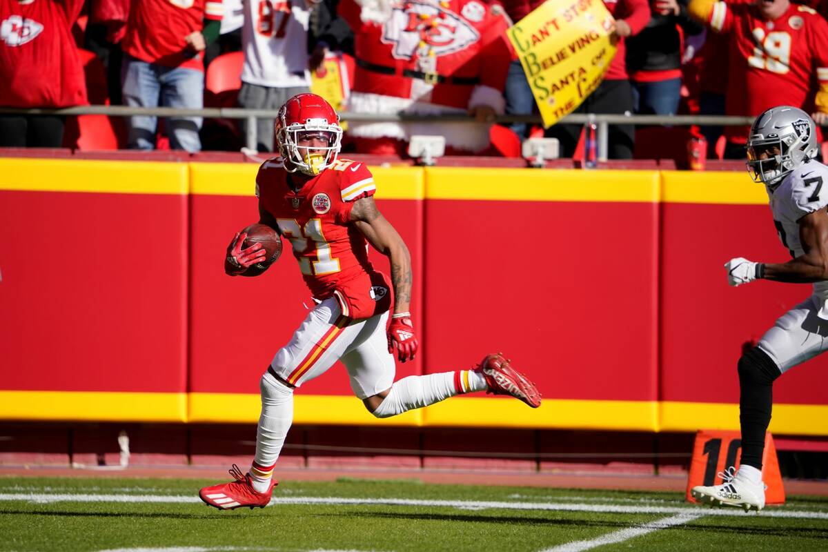 Kansas City Chiefs cornerback Mike Hughes runs a fumble recovery back for a touchdown during th ...