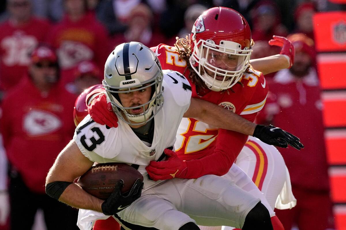 Las Vegas Raiders wide receiver Hunter Renfrow (13) struggles for yardage as Kansas City Chiefs ...