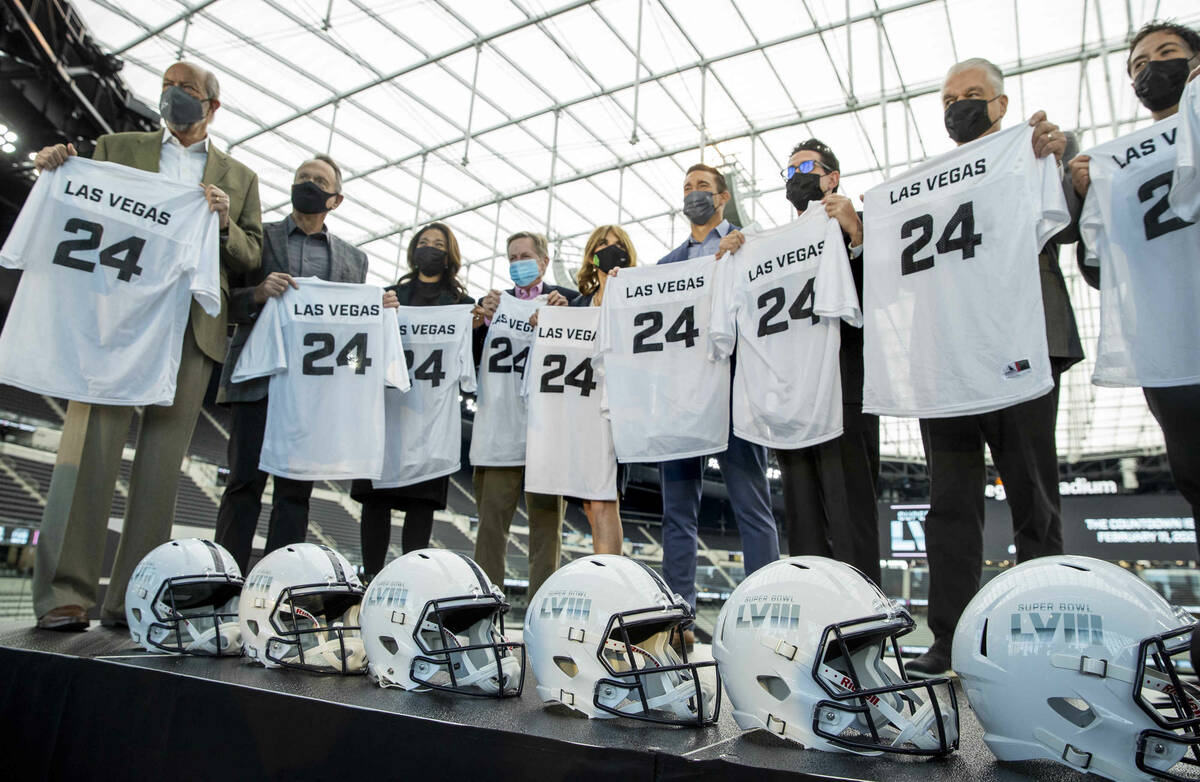 VIP guests hold ceremonial jerseys on stage following a press conference event announcing the N ...