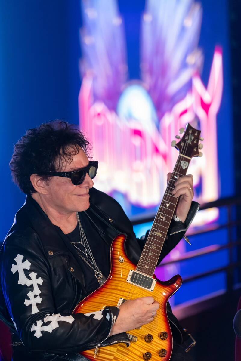 Guitar legend Neal Schon of Journey is shown performing at a press conference at the Theater at ...