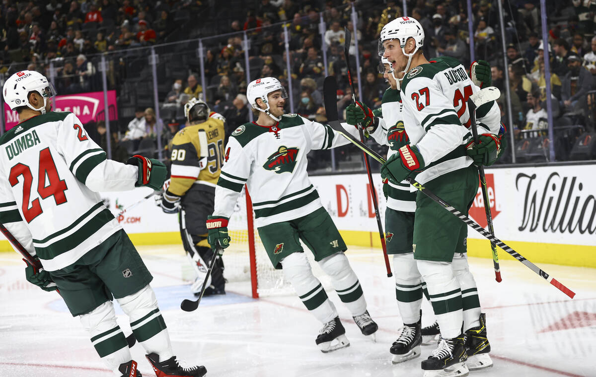 The Minnesota Wild celebrate after a goal against the Golden Knights during the second period o ...