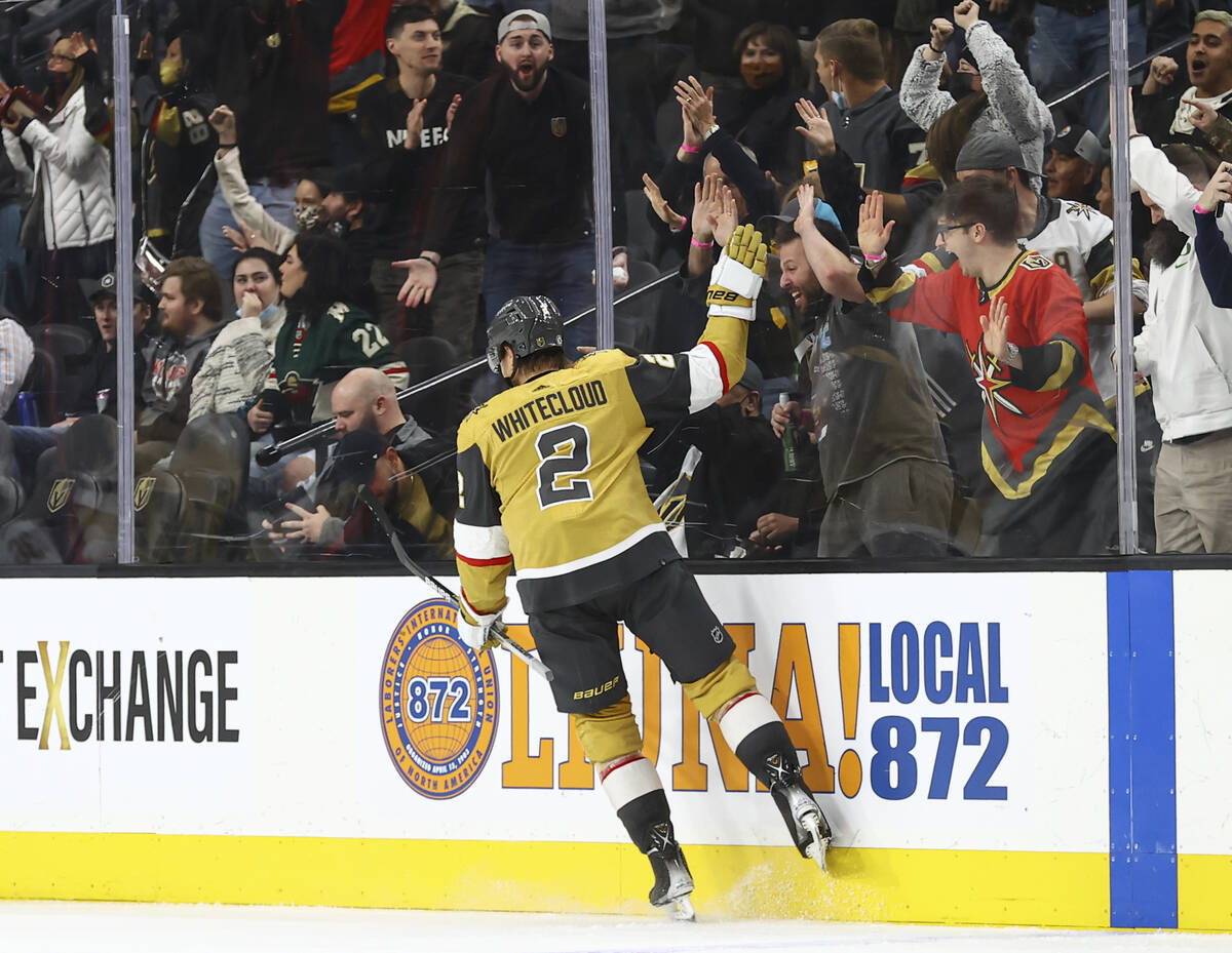 Golden Knights defenseman Zach Whitecloud (2) celebrates after his goal against the Minnesota W ...