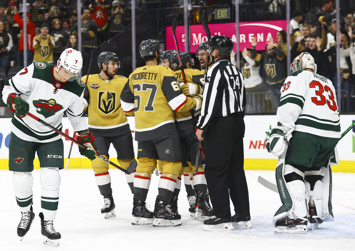 The Golden Knights celebrate after a goal against the Minnesota Wild during the first period of ...