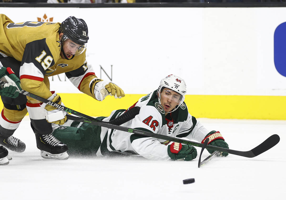 Golden Knights right wing Reilly Smith (19) and Minnesota Wild defenseman Jared Spurgeon (46) v ...