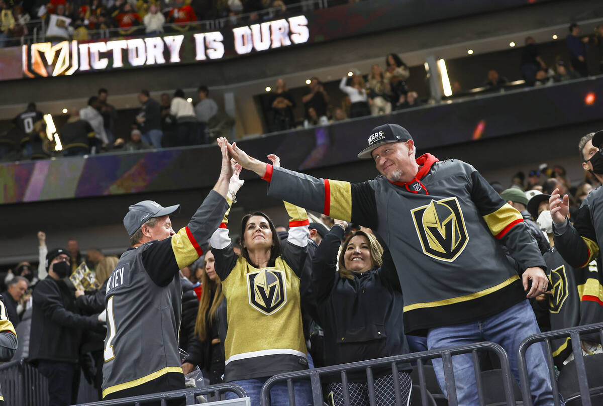 Golden Knights fans celebrate after a victory over the Minnesota Wild in an NHL hockey game at ...