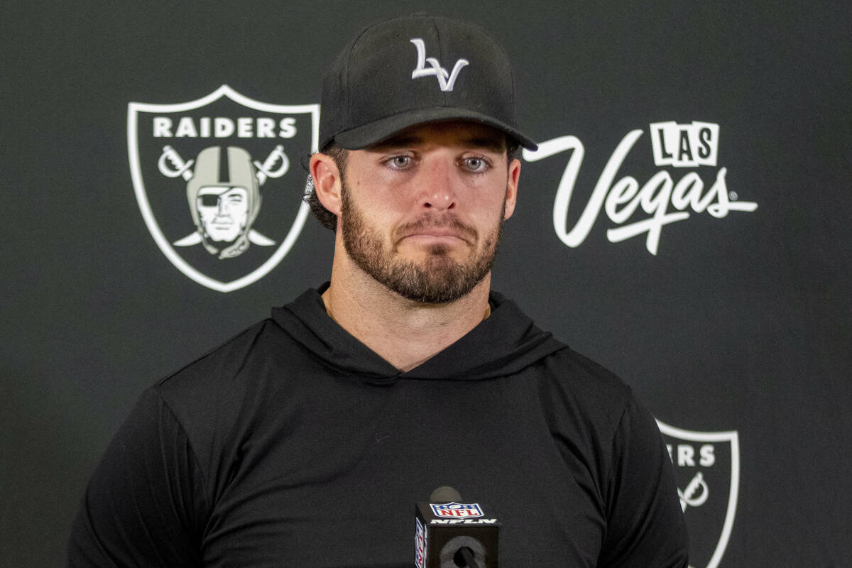 Raiders quarterback Derek Carr takes media questions during the postgame news conference after ...