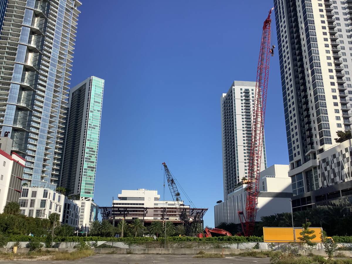 High-rises and construction cranes in downtown Miami are seen near a plot of land owned by deve ...