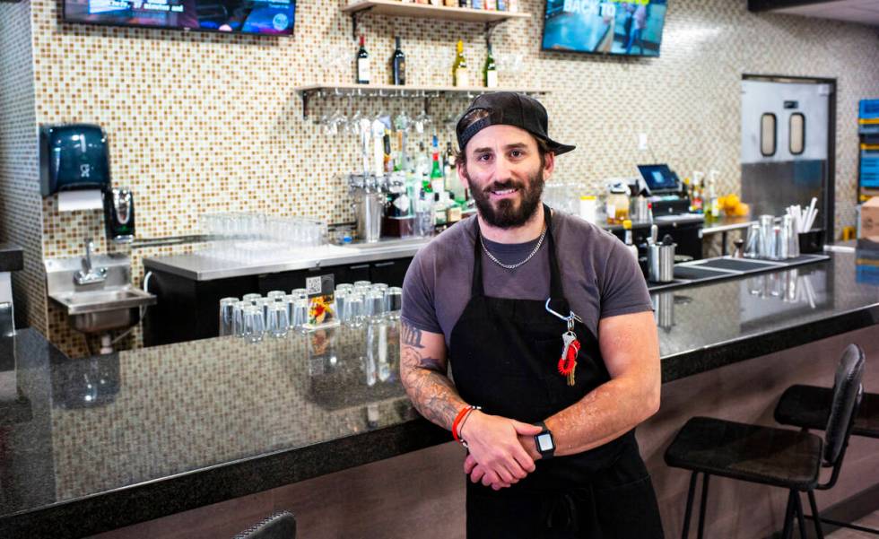 Matthew Meyer, proprietor  and cook  astatine  Served Global Cuisine, poses for a representation    successful  the caller   sushi b ...