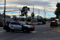 Las Vegas police, including a SWAT unit respond to a neighborhood near a middle school in south ...