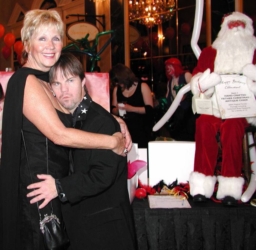 Linda Smith and her son Chris share a moment during the Opportunity Village 50 year celebration ...
