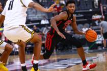 UNLV Rebels guard Bryce Hamilton (13) drives to the basket against Wichita State Shockers forwa ...