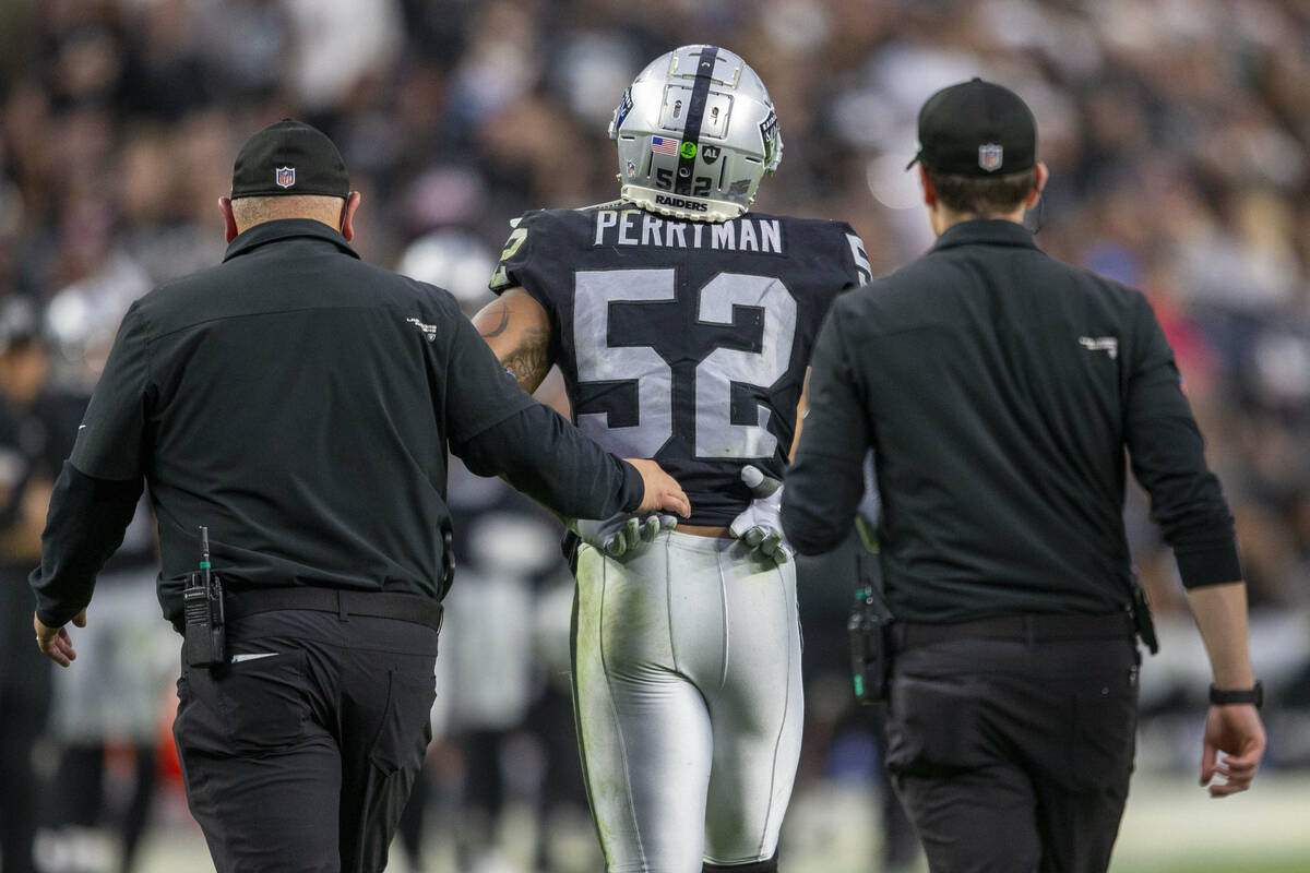 Raiders middle linebacker Denzel Perryman (52) walks off the field after being injured during t ...